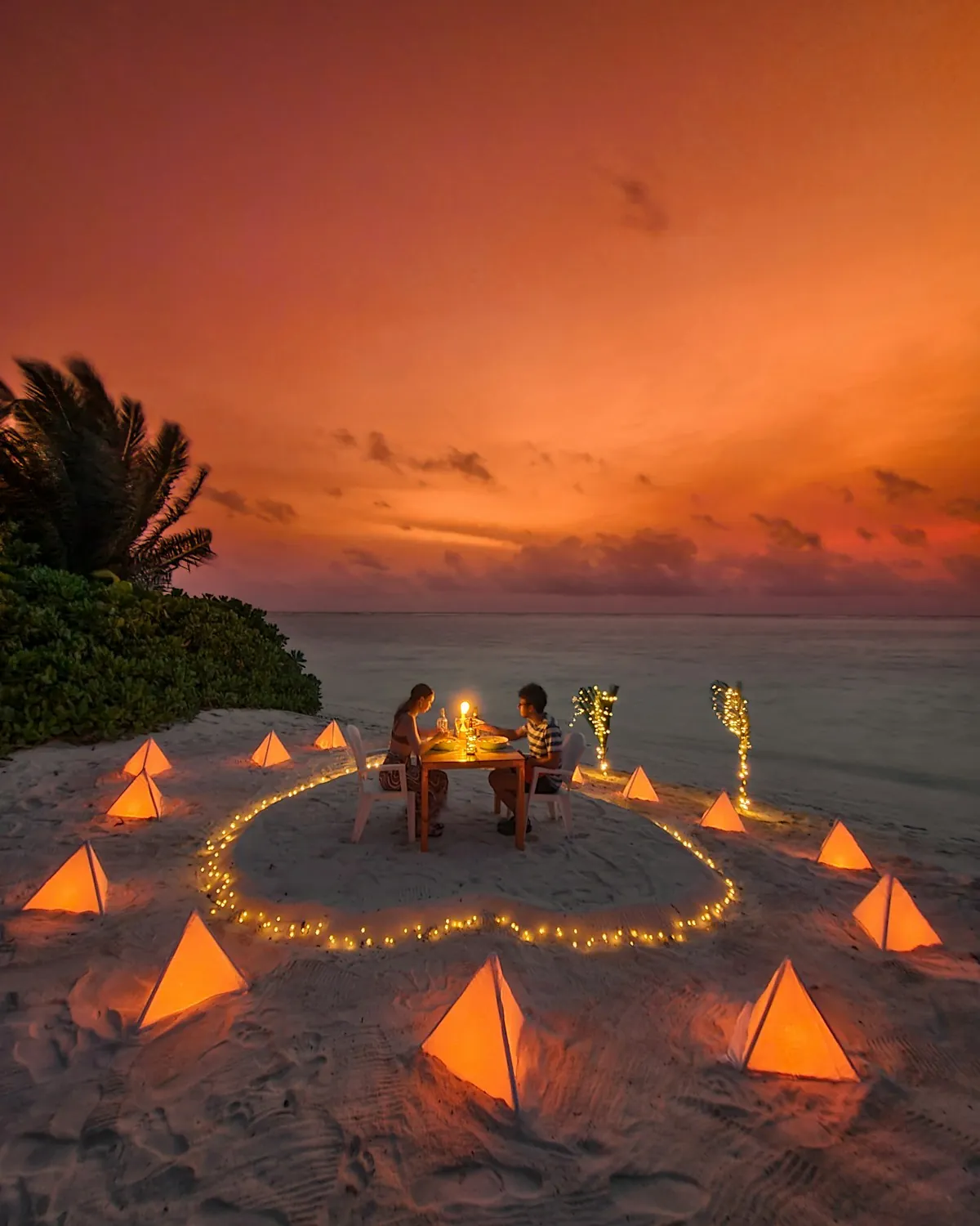 Overwater villa and lagoon at sunset